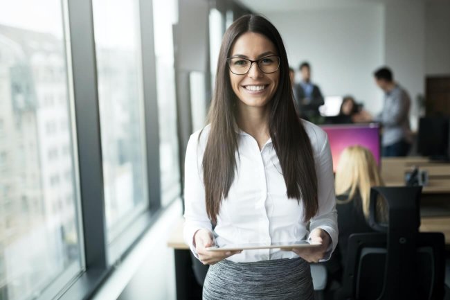 Portrait of happy smiling beautiful brunette businesswoman